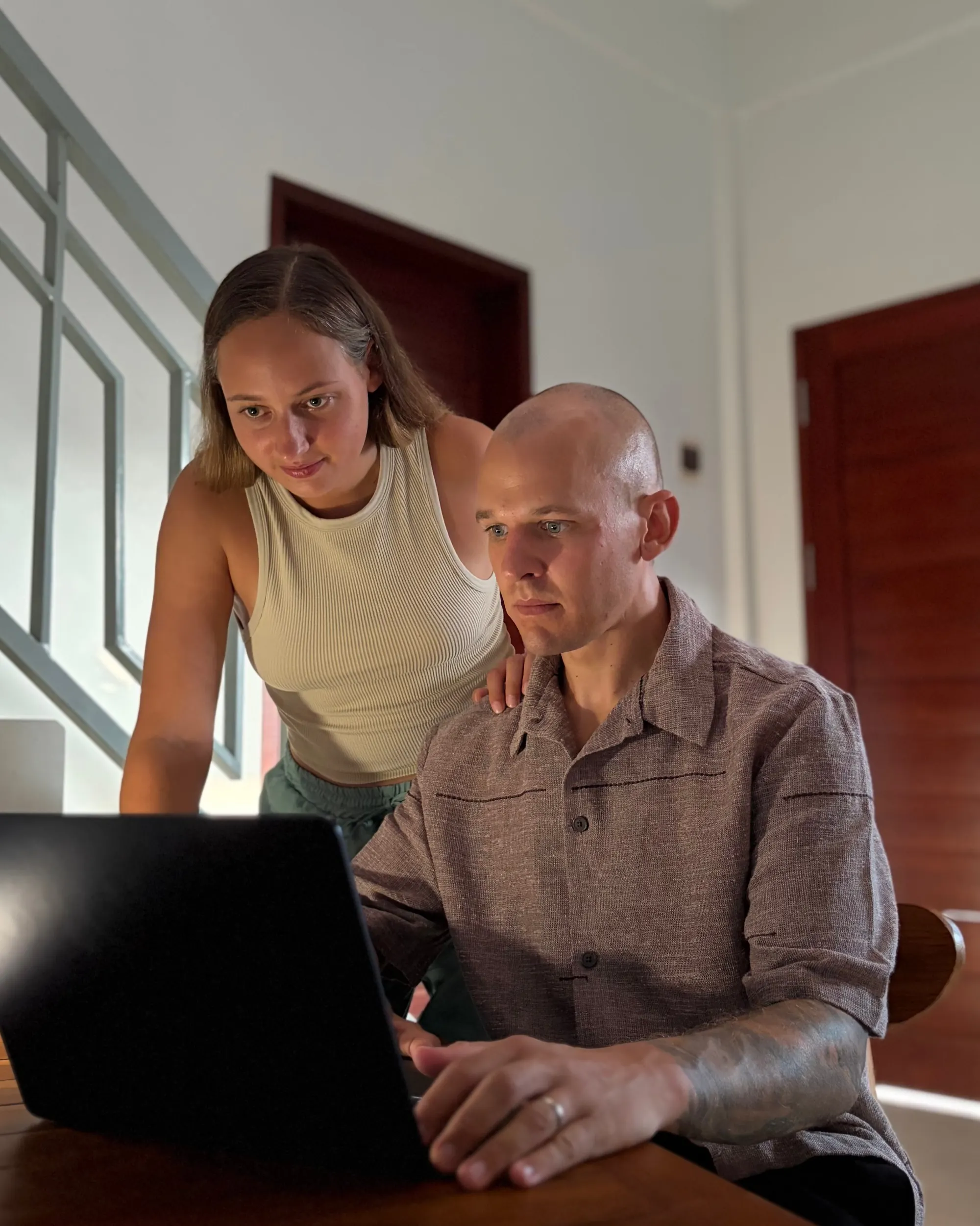 Tanja and Christoph collaborating at their laptop